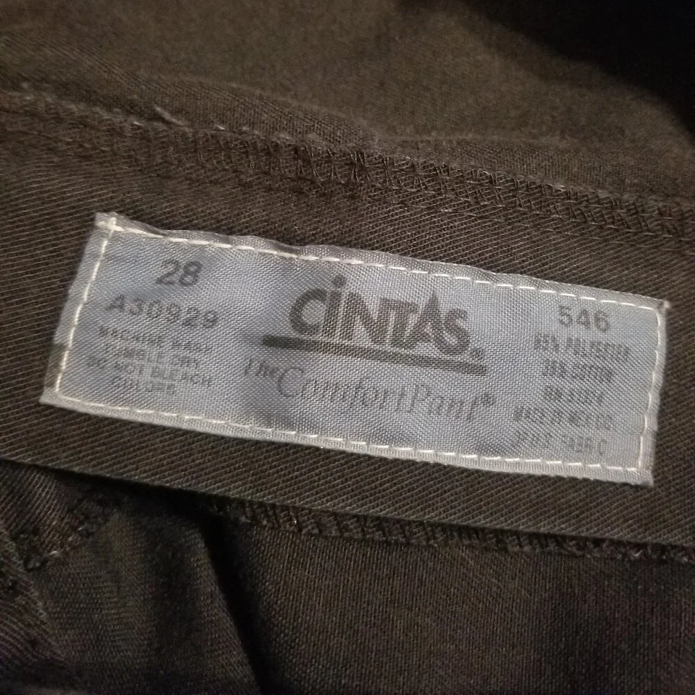 Three stained Cintas men's pants with stretching waistbands